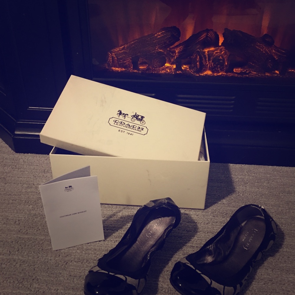 Coach Black/White never worn slip ons. Size 5.5